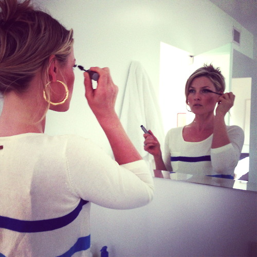 Ali putting on makeup for a night at the beach